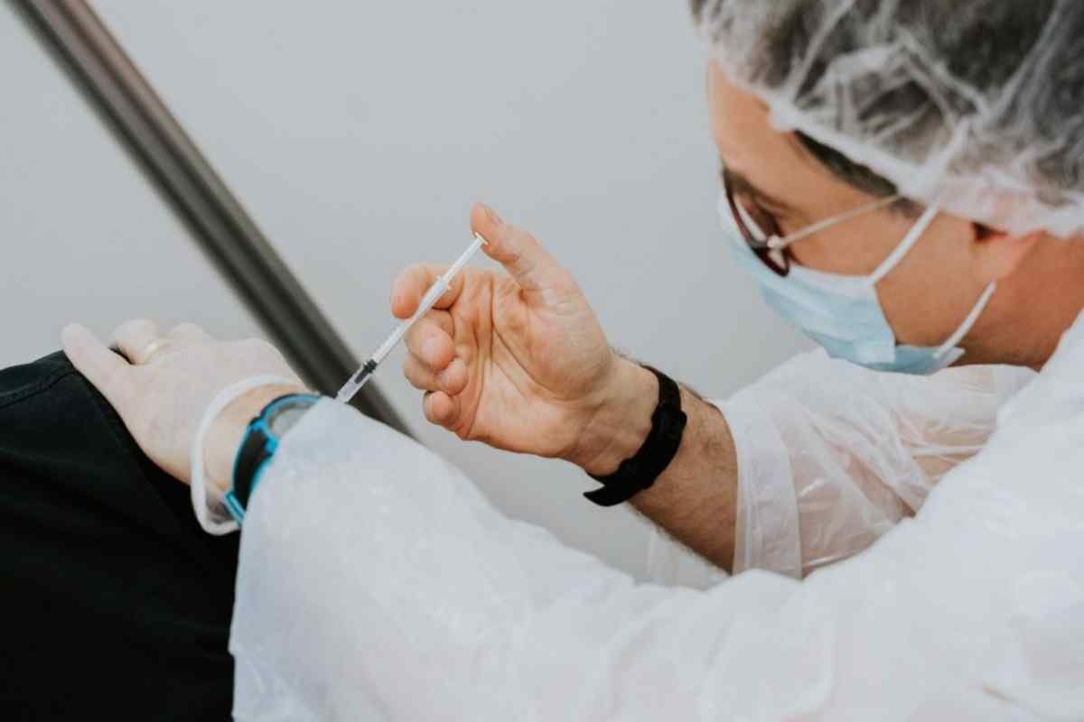 Women injecting vaccine